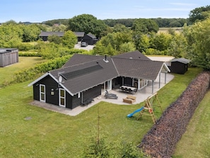 A residential property with a large patio area, a play structure, and a covered outdoor seating area. - 5 Star Holiday Home in Ebeltoft (Ebeltoft)