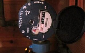 A device with a label, a circular dial, and a small window.