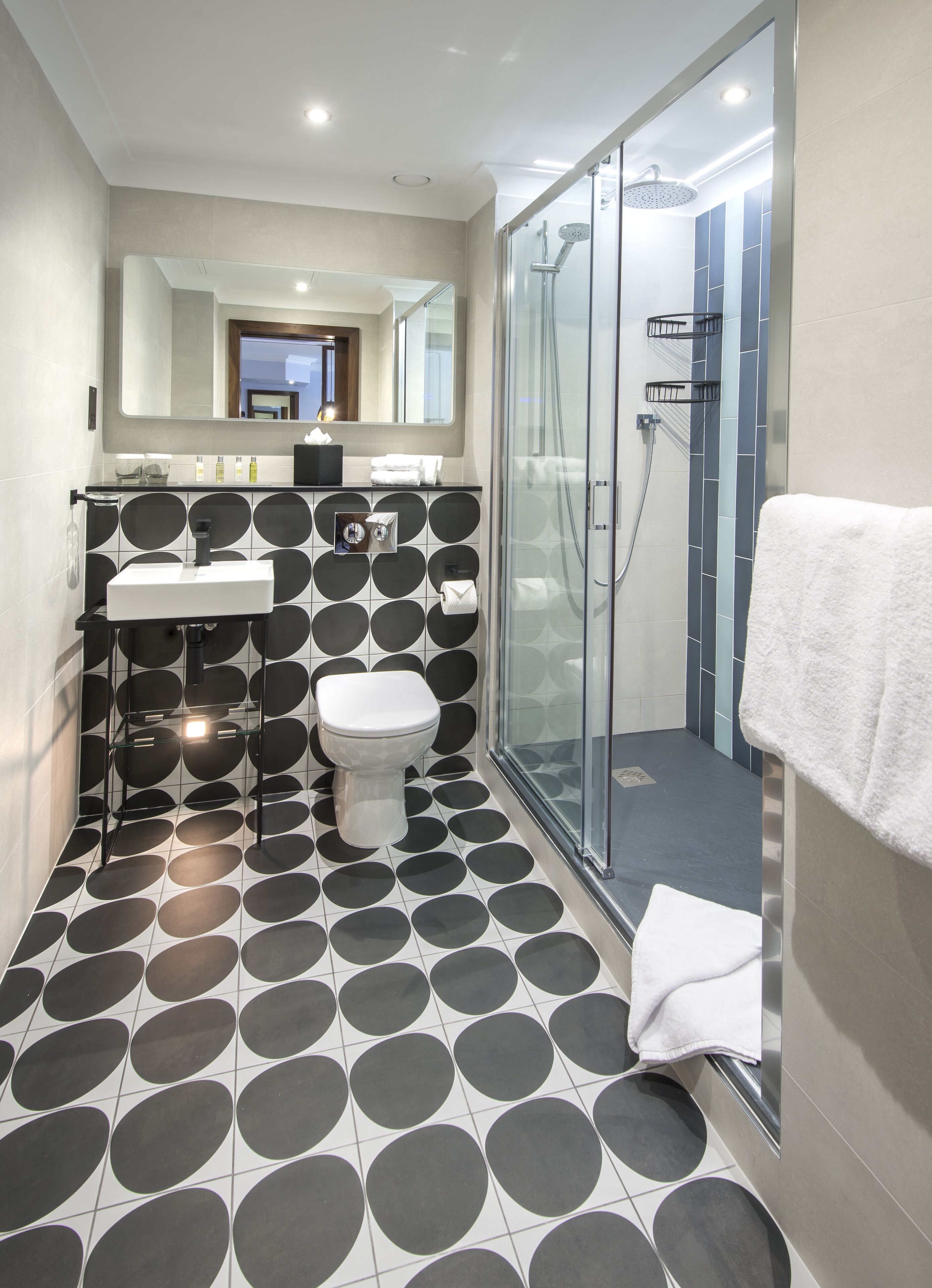 shower, rainfall showerhead, hair dryer, towels