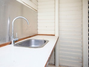 A small kitchen with a single stainless steel sink and a faucet. - 4 Person Holiday Home in Ans By (Ans)
