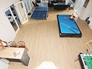A room with a ping pong table, a pool table, and a foosball table. - 5 Star Holiday Home in Frorup (Frørup)