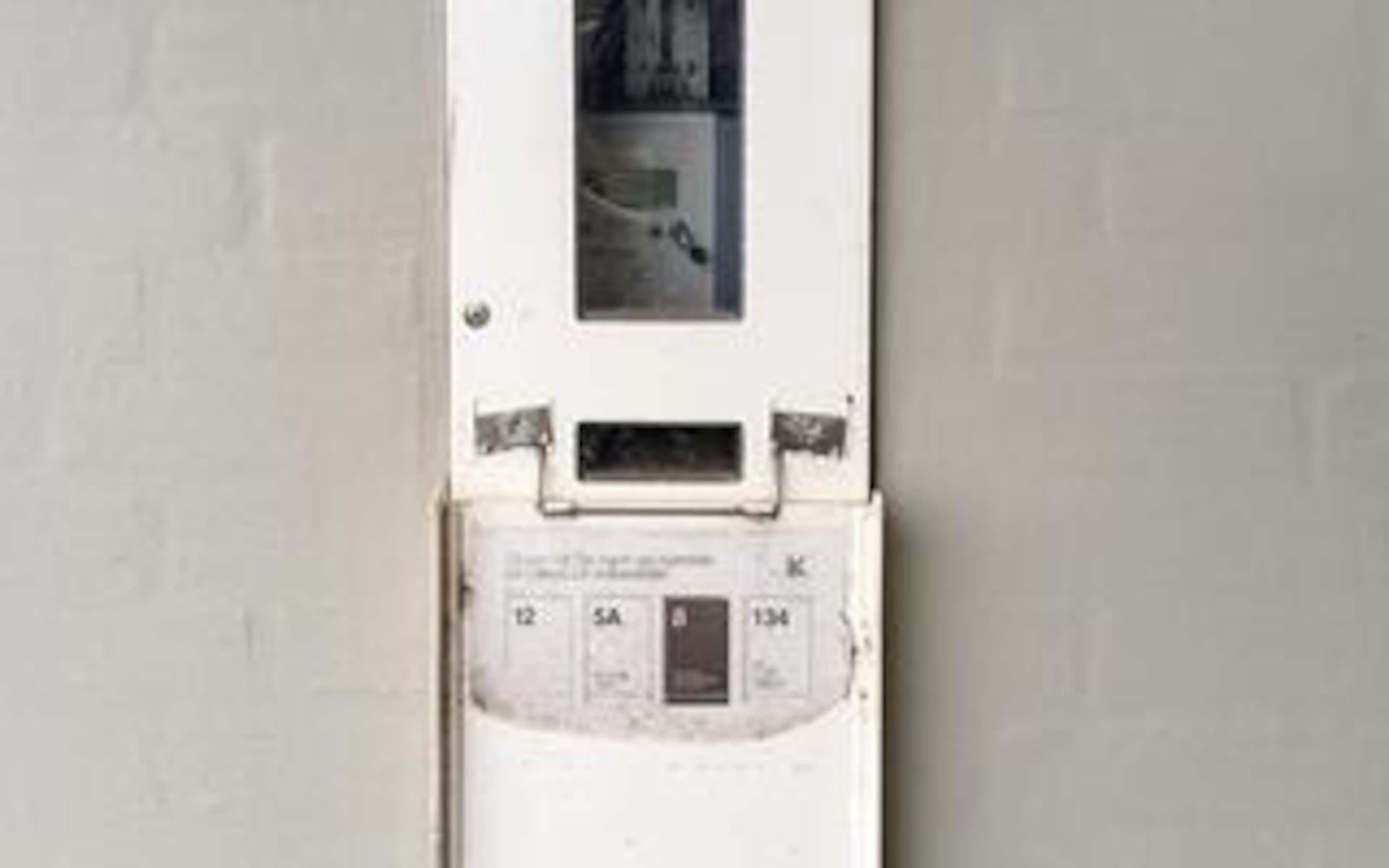 A utility meter with labels and numbers.