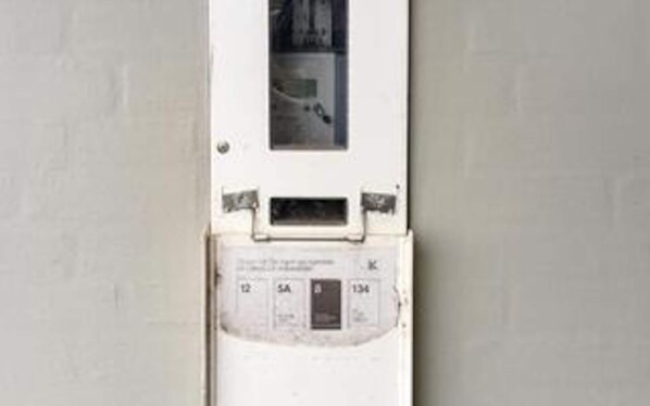 A utility meter with labels and numbers.