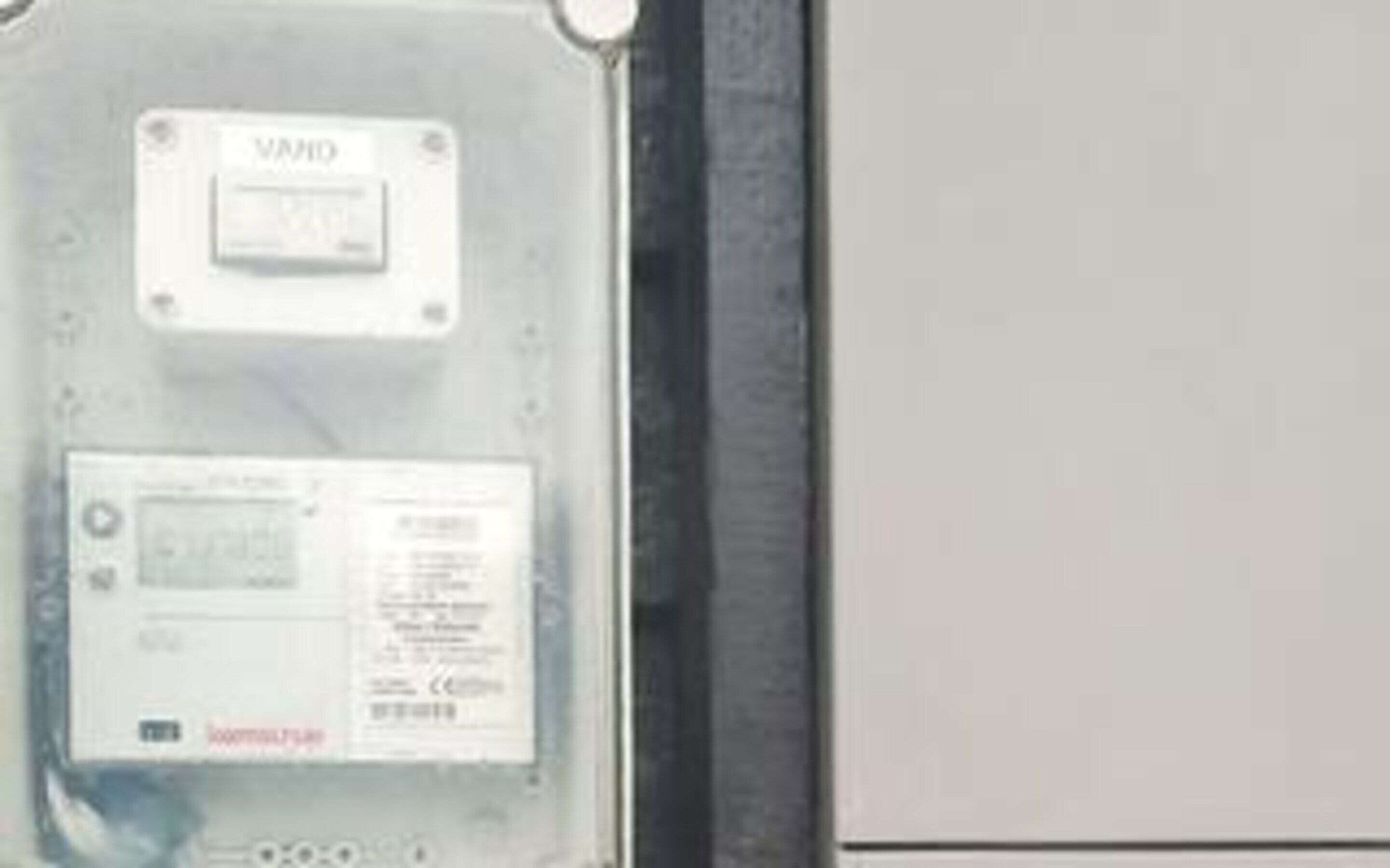 A control panel with a VAIO label, a power button, and a display screen.