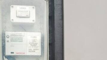 A control panel with a VAIO label, a power button, and a display screen.