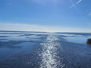 A calm body of water reflecting sunlight with a clear sky above. - Tranquil Holiday Home in Ringkøbing near Sea (Ringkobing)