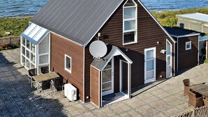 A coastal house with a sloped roof, large windows, and a satellite dish. - 6 Person Holiday Home in Brenderup Fyn-by Traum (Middelfart)