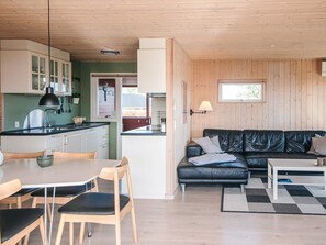 A compact living space with a kitchen, dining area, and a seating area. - Spacious Holiday Home in Hejls near Sea (Hejls)
