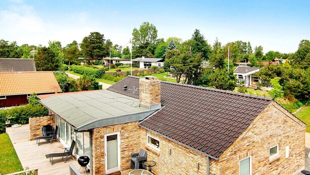 A residential building with a covered patio, a brick exterior, and a view of a residential area. - 5 Star Holiday Home in Sydals (Sydals)