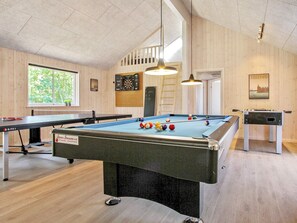 A billiards room with a pool table, a foosball table, and dartboards. - 5 Star Holiday Home in Frederiksvaerk (Frederiksvaerk)