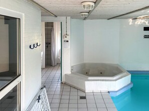 A bathroom with a bathtub, a shower, and a toilet.