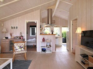 A compact living space with a kitchenette, a dining area, and a bedroom. - 4 Person Holiday Home in Follenslev (Follenslev)