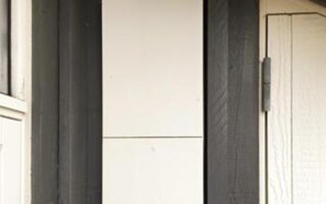 A white door with a dark frame, a white wall, and a dark door frame. - 5 Star Holiday Home in Hirtshals (Hirtshals)