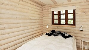 Une chambre aménagée dans un chalet en rondins, avec un lit, une fenêtre avec des rideaux et une petite table avec une lampe.