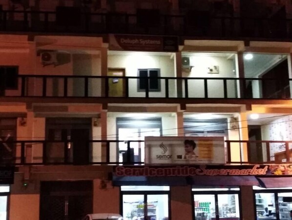 Stylish building with a supermarket on the ground floor and residential units above.