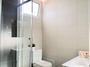 Shower, hair dryer, towels, soap