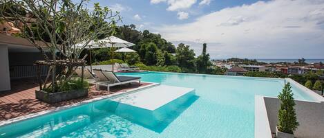 Outdoor pool, pool umbrellas, sun loungers