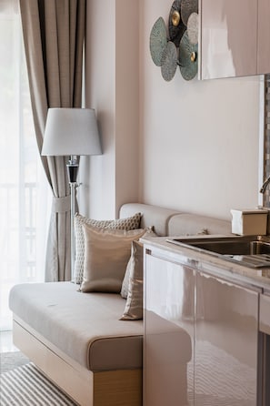 Comfort Apartment | Living area | 54-inch flat-screen TV with satellite channels, TV