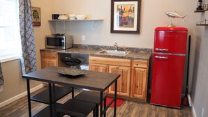 Deluxe Cabin, 2 Bedrooms | Private kitchen | Mini-fridge, microwave, cookware/dishes/utensils - Grub House Coffee & Cabins (Island Park)
