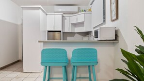 Fridge, microwave, stovetop, coffee/tea maker