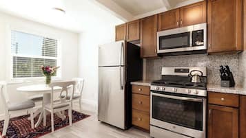 Fridge, coffee/tea maker, cookware/dishes/utensils