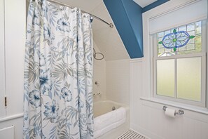 Bathtub, hair dryer, towels, soap