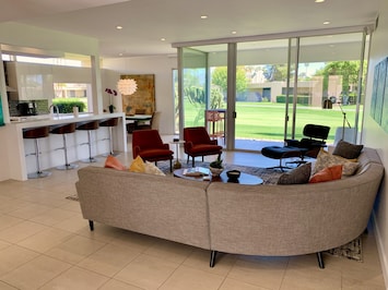 Light and cheerful formal living room. Perfect for hosting a cocktail party.