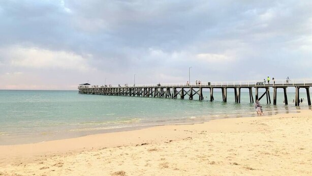 A beach with a pier extending into the water. - Our most popular home. Your family and staff will love it here! Bed & bath linen hire included. Unlimited NBN WIFI internet. Airconditioning throughout. Easy Parking. Spacious and relaxing. (Richmond)