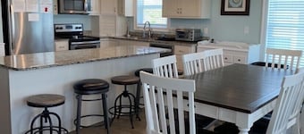 Amazing sunsets and ocean breezes await you at this beautiful beach view home.