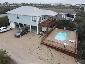 A two-story house with a covered deck and a swimming pool. - Amazing sunsets and ocean breezes await you at this beautiful beach view home. (Port St Joe)