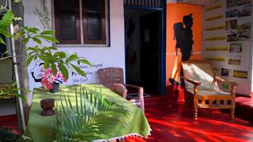 Comfort Quadruple Room, 1 Bedroom, Garden View, Lakeside | Living area | Fireplace