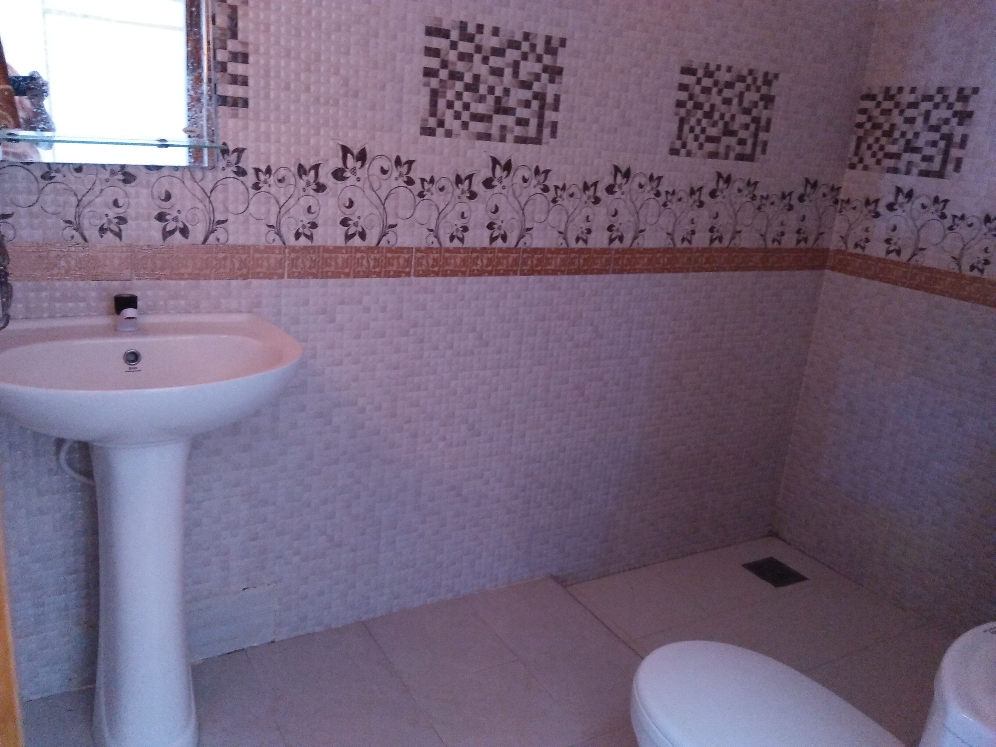 Separate bathtub and shower, free toiletries, hair dryer, slippers