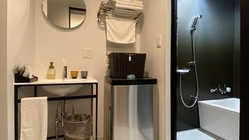 Separate bathtub and shower, free toiletries, hair dryer, slippers