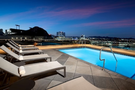 Outdoor pool, open 6:00 AM to 11:00 PM, pool umbrellas, sun loungers