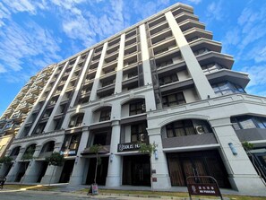 Experience the Solis Hotel's sleek, multi-story design with spacious balconies on every floor.