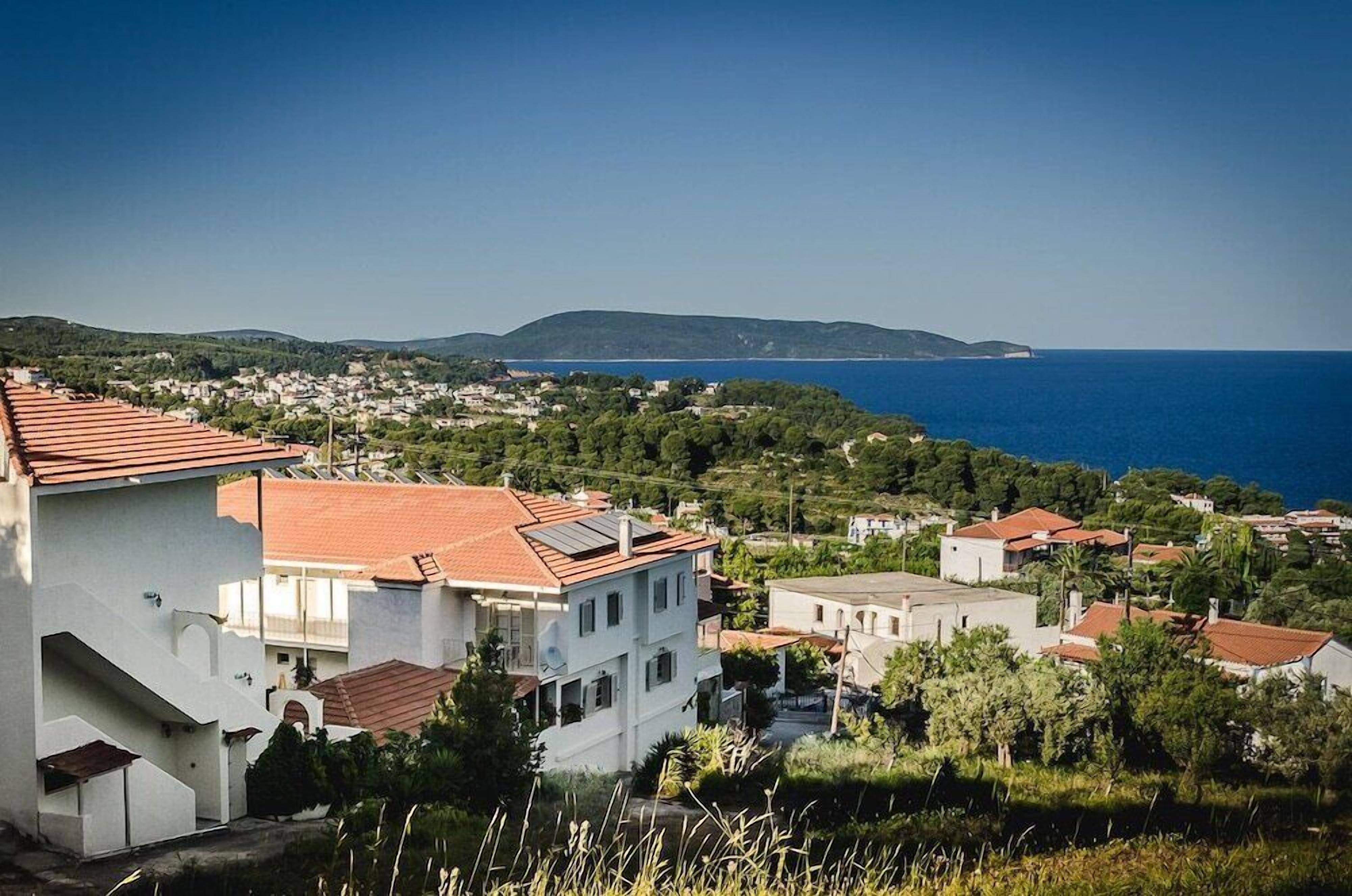 A coastal town with buildings and a view of the sea.