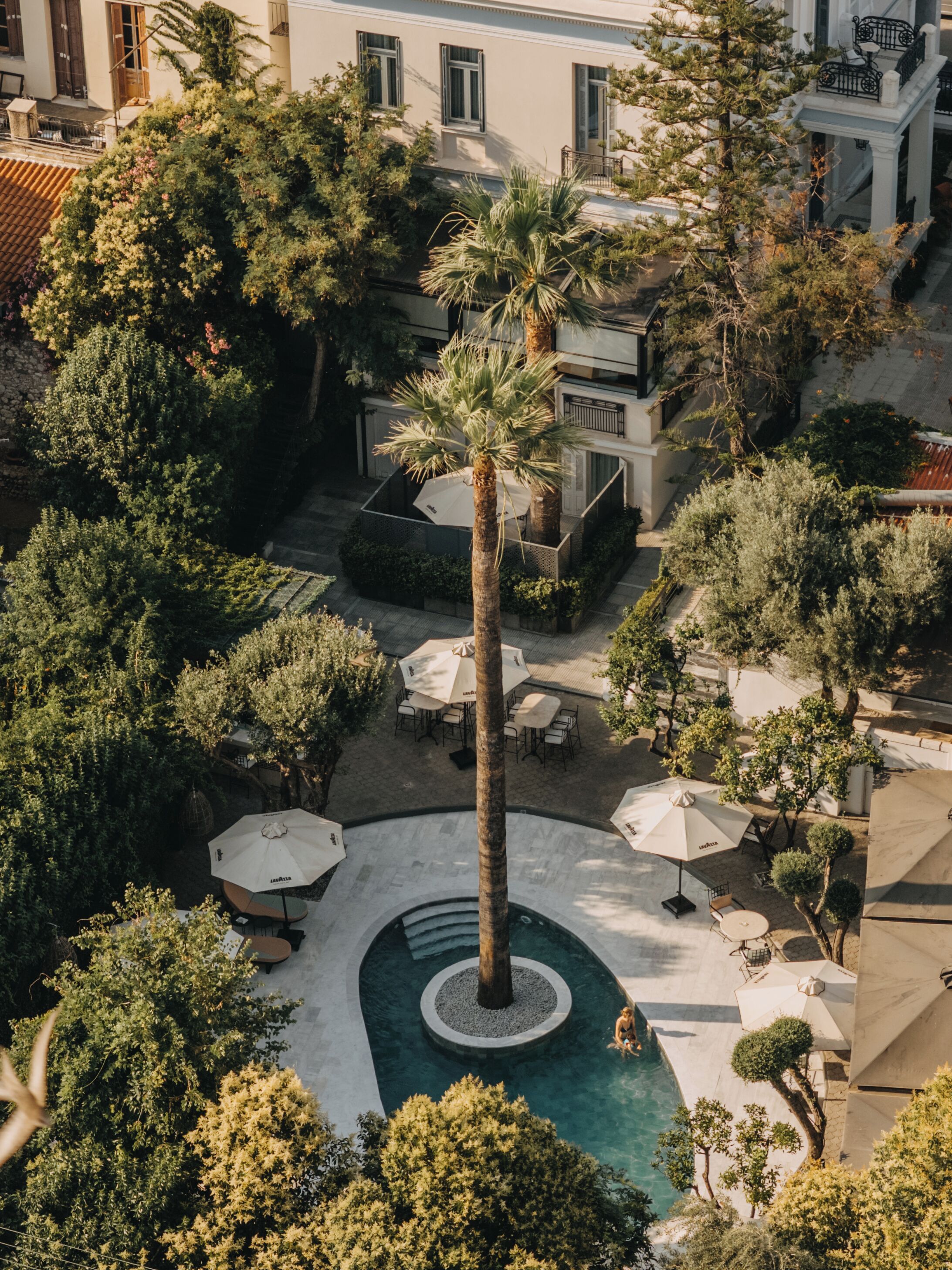 Seasonal outdoor pool, open 10:00 AM to 7:00 PM, pool umbrellas