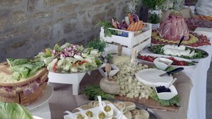 A buffet with various food items including salads, cheeses, and meats. - Villa Panorama (Monte Santa Maria Tiberina)