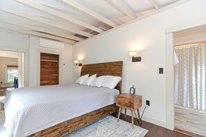 Architectural details include the exposed wooden beams and a cedar closet in the primary bedroom.