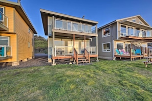 Enjoy outdoor living with a spacious deck and comfortable seating for entertaining guests.