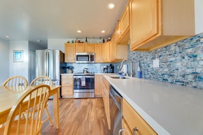 Enjoy meals in the kitchen with a dining area and stainless steel appliances.