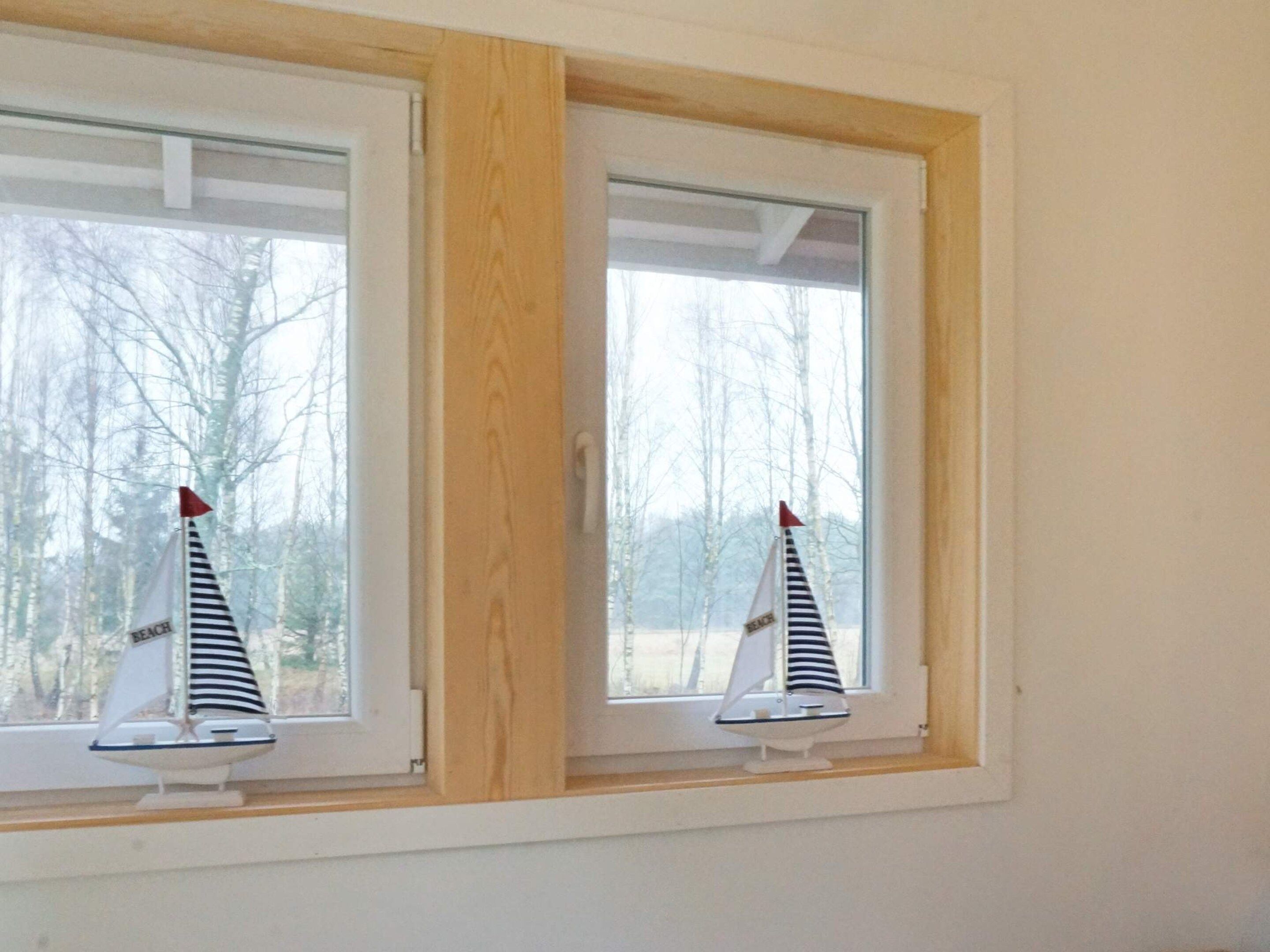 A window with two small sailboats.