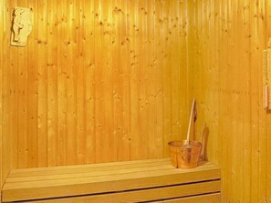 A wooden sauna with a bench and a cup holder. - 4 Person Holiday Home in Hastveda (Hästveda)