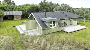 A single-story house with a front deck and a small porch.