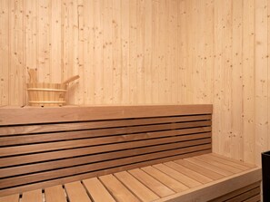 A wooden sauna bench with a slatted design. - 5 Star Holiday Home in Lokken (Lokken)