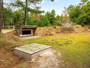 Situated in a serene natural setting, this charming cabin offers a tranquil retreat.