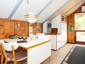 Enjoy meals at the dining table with comfortable seating for all.