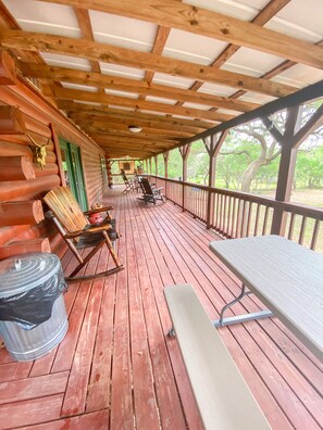 Outdoor dining - Cozy and secluded Log Cabin near the Frio River with a private pool! (Concan)