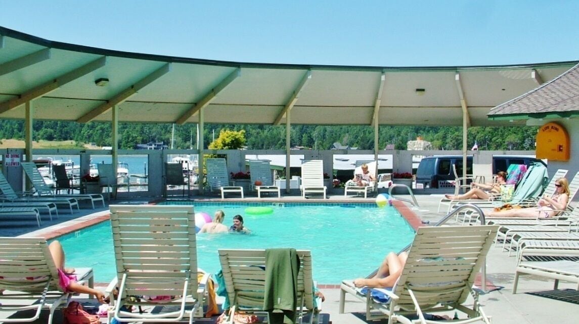 seasonal outdoor pool, pool umbrellas, pool loungers