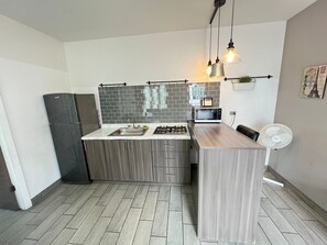 PedWest 2BR/1B TJ Border Suites 02 | Private kitchen | Full-size fridge, microwave, coffee/tea maker, toaster